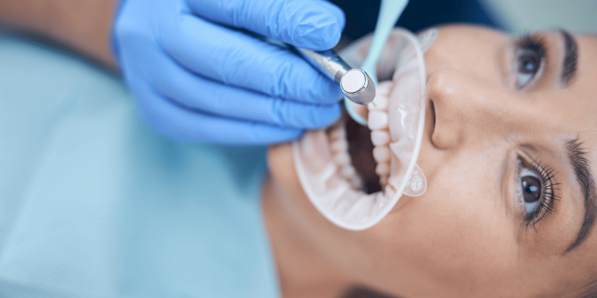 Dentist observing patient's teeth